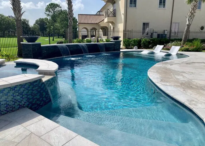 pool & spa water feature in backyard