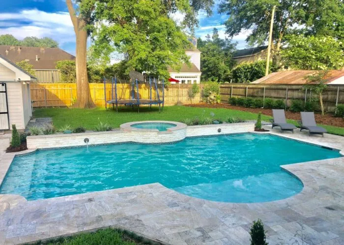 pool and spa in a backyard