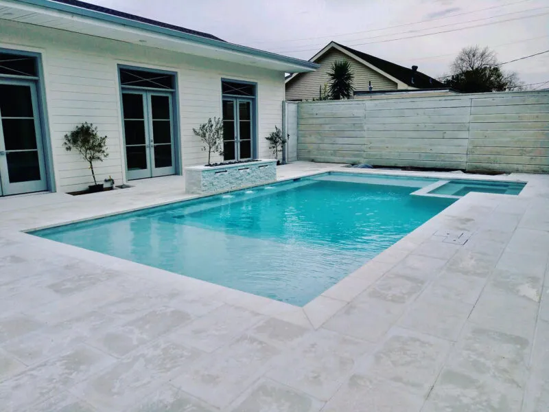 pool and spa in a backyard