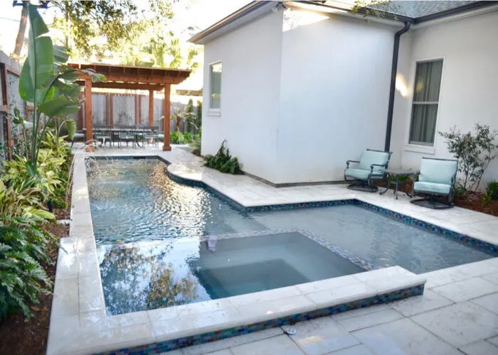 pool and spa in a backyard