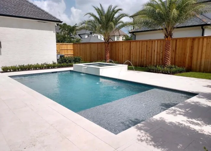 pool & spa water feature in backyard