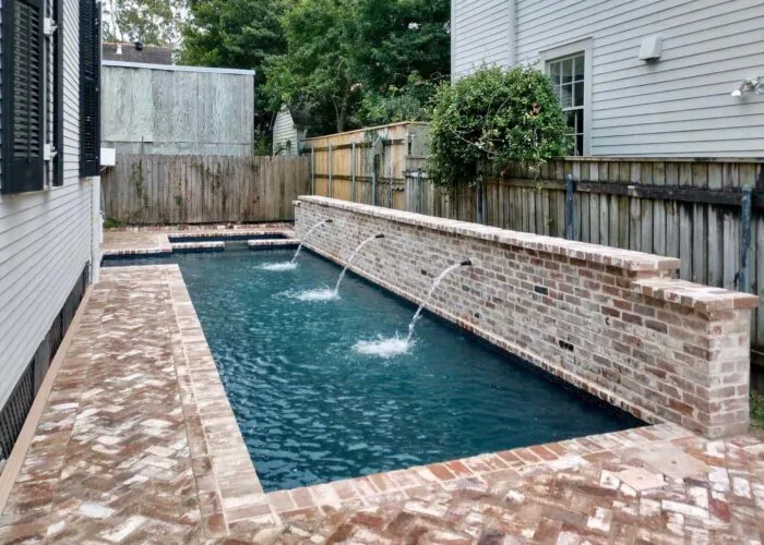 pool water feature at the side of the house